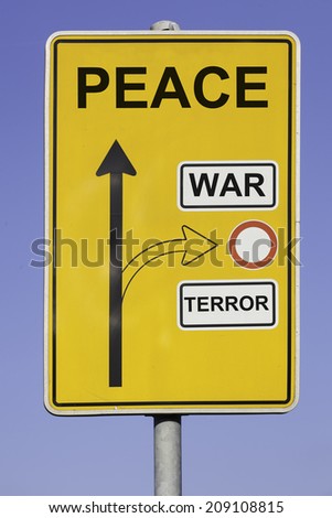 blue sky behind a yellow road sign with an vertical arrow pointing to peace and a second arrow pointing to war and terror at the right hand side.