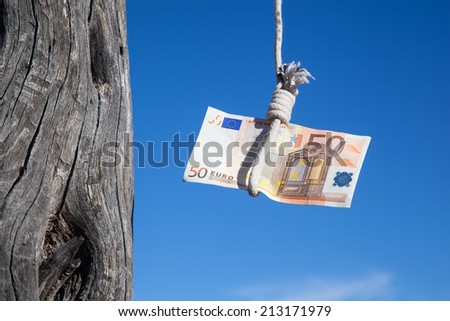 one fifty Euro banknote hanging in the air at a  gibbet cord: Concept for Euro crisis, financial benefit or trap