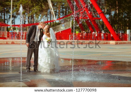 bride and a groom near the fountain