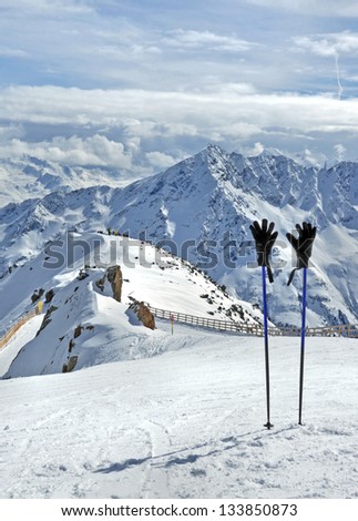 Ski sticks with gloves at the top of Gaislachkogel near Solden in Otztal Alps in Tirol, Austria