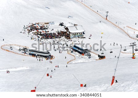 MAYRHOFEN, AUSTRIA â?? MARCH 14, 2012: Mayrhofen Ski resort middle station area with ski lifts, pistes and skiers. Zillertal Alps, Tirol..