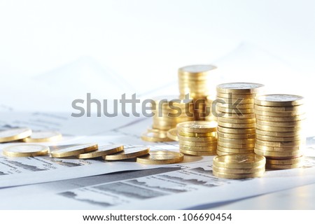 Business diagram on financial report with coins