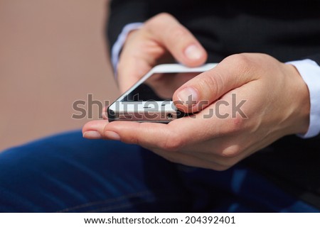 woman\'s hands with mobile phone