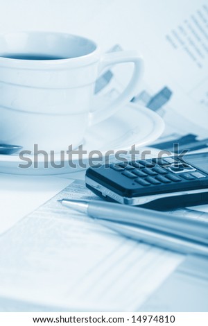 Cup  coffee on a morning paper business news