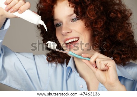 Young beauty woman clean teeth