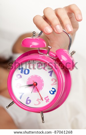 beautiful woman  and alarm clock