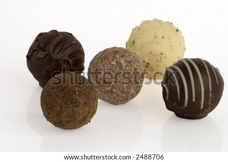 Isolated assorted truffles on white