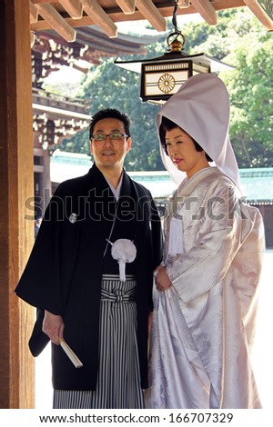 Tokyo, Japan - April 1, 2012: Married Couple Wearing Traditional Costumes During Wedding Ceremony At Meiji Shrine In Tokyo.