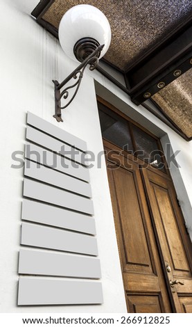 Classic business center doors with editable company plates fixed on the wall