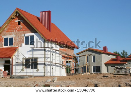 Empty new home construction site on clear summer day with blue sky