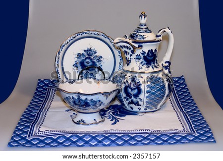 tea-pot, dish, vase, standings on a serviette, designed in Russian style in blue tones