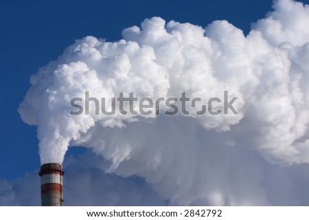 smoking pipes of factory, contaminating an environment on a background clean sky