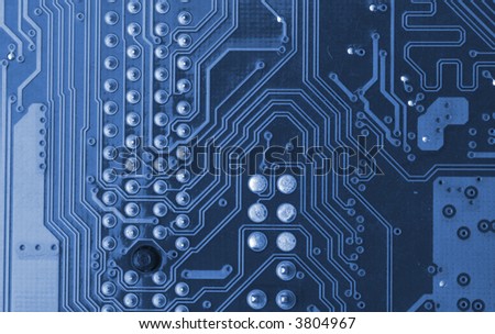 blue microcircuit with chip of condensers, resistors and transistors