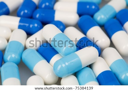 Set of white blue tablets as a background on medical subjects