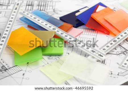 color samples of architectural materials - plastics,  Metric Folding ruler and architectural drawings of the modern house