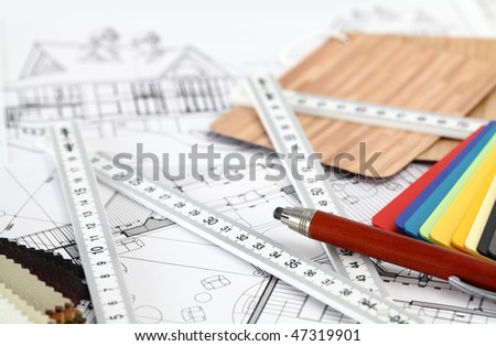 color samples of architectural materials - plastics,  Metric Folding ruler and architectural drawings of the modern house