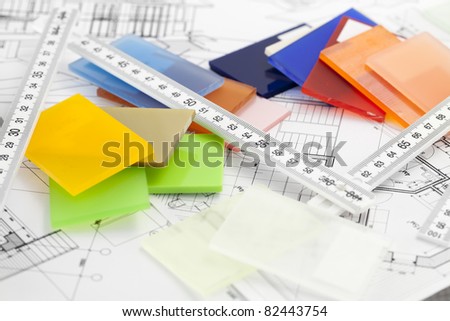 color samples of architectural materials - plastics,  metric folding ruler and architectural drawings of the modern house