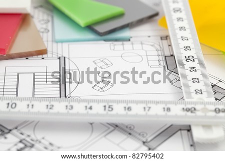 color samples of architectural materials - plastics,  metric folding ruler and architectural drawings of the modern house