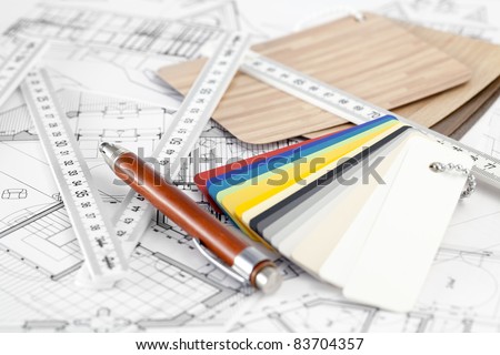 color samples of architectural materials - plastics,  metric folding ruler, pencil & architectural drawings of the modern house