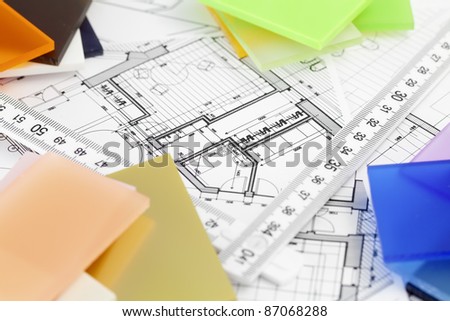 color samples of architectural materials - plastics, metric folding ruler and architectural drawings of the modern house