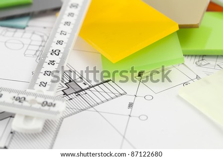 color samples of architectural materials - plastics, metric folding ruler and architectural drawings of the modern house