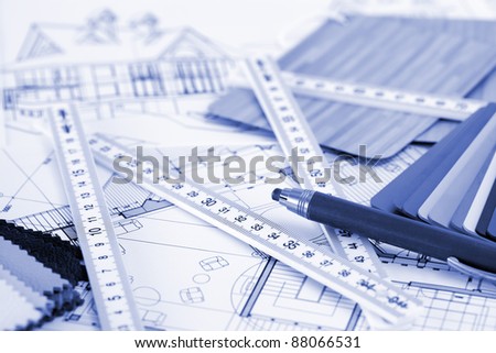 samples of architectural materials - plastics,  metric folding ruler, pencil & architectural drawings of the modern house