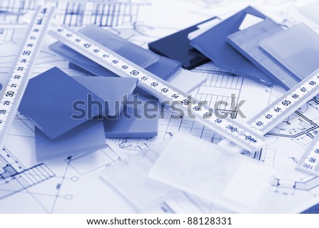 samples of architectural materials - plastics, metric folding ruler and architectural drawings of the modern house