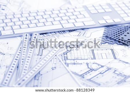 computer keyboard, samples of materials and architectural plans