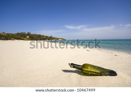 bottle with a message inside on a tropical beach.