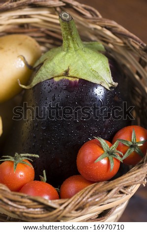 a basket full of fresh vegetables. Mediterran cuisine essential ingredients.