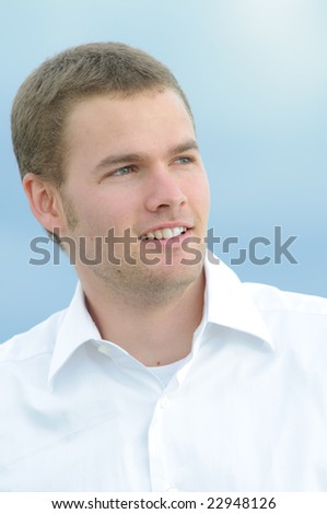 Guy with white shirt smiling.