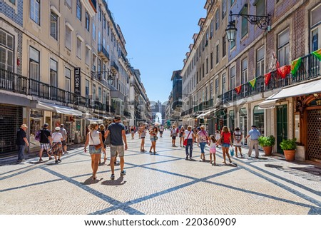 Lisbon, Portugal. August 31, 2014: Augusta Street with the Triumphal Arch seen at the end of it connecting the most famous Lisbon street to Terreiro do Paco Square aka Praca do Comercio.