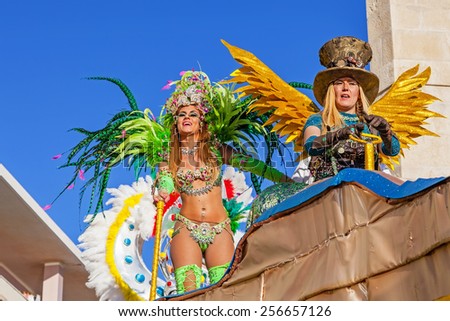 Sesimbra, Portugal. February 17, 2015: Liliana Filipa Antunes (left), a star from the Secret Story Reality Show, performing on top of a Float in the Rio de Janeiro Brazilian style Carnaval Parade.