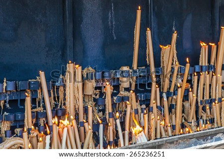 Sanctuary of Fatima, Portugal. Votive candles burning in the pyre as fulfillment of vows made to Our Lady. Fatima is one of the most important pilgrimage locations for Catholics