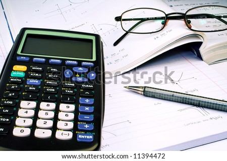 Scientific Calculator with exercise books and glasses
