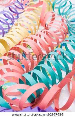 Several colourful party paper ribbons and confetti