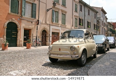 stock photo Little vintage Fiat 500 car on the street of Verona