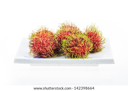 Rambutan asian fruit on a white background