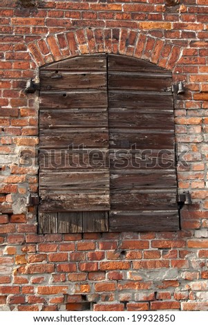 closed cargo door of old  brick warehouse