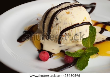 ice cream dessert with topping on the plate