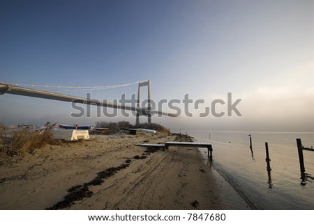 Over Blue water - Beautiful Suspension Bridge – Blue and cold December day in Denmark