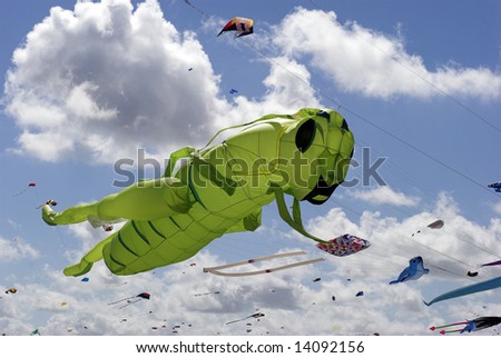 Green Grasshopper Kite, Fantasy Kite High-Up in the Sky a Sunny Day on the Beach