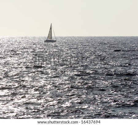 Sunlight Sea and Sailing. Sailboat in the Mediterranean Sea just outside Corsica Island, France.