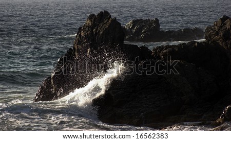 Surf Waves. Where the waves crash against the rock cliff