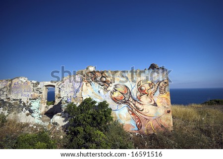 Graffiti Corner. Mediterranean home in disrepair with graffiti all over. Close to the Mediterranean Sea