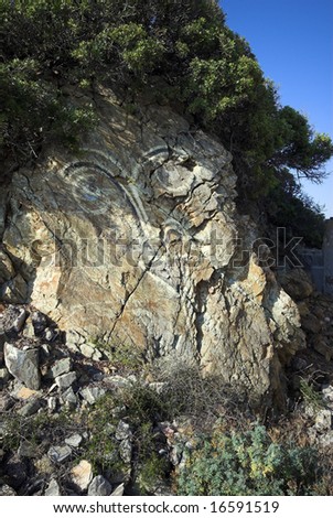 Rock Face Graffiti. Rock on Corsica with graffiti