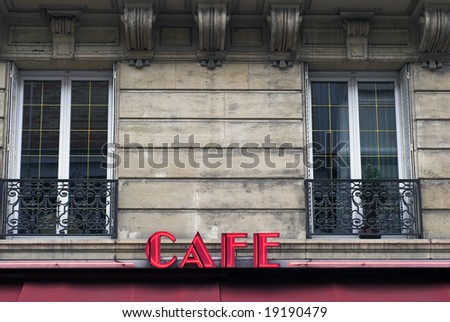 Red cafe sign in Paris on a wall