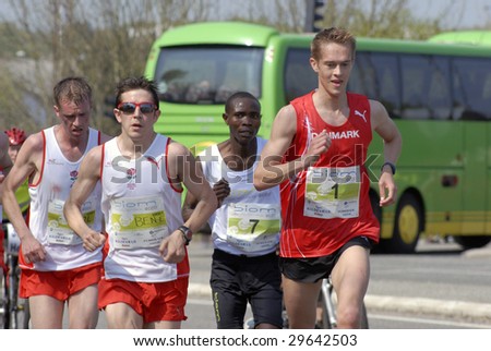 FREDERICIA - MAY 2: Leading male group passing 14 km. Little Belt Half Marathon. David Kidet (number 7) vinner of the race and runner up Jesper Faurschou ( number 1). 2nd of May, 2009. Denmark.
