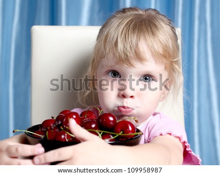 the nice girl and is a lot of cherry in a plate