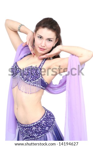 The young girl dances belly dance